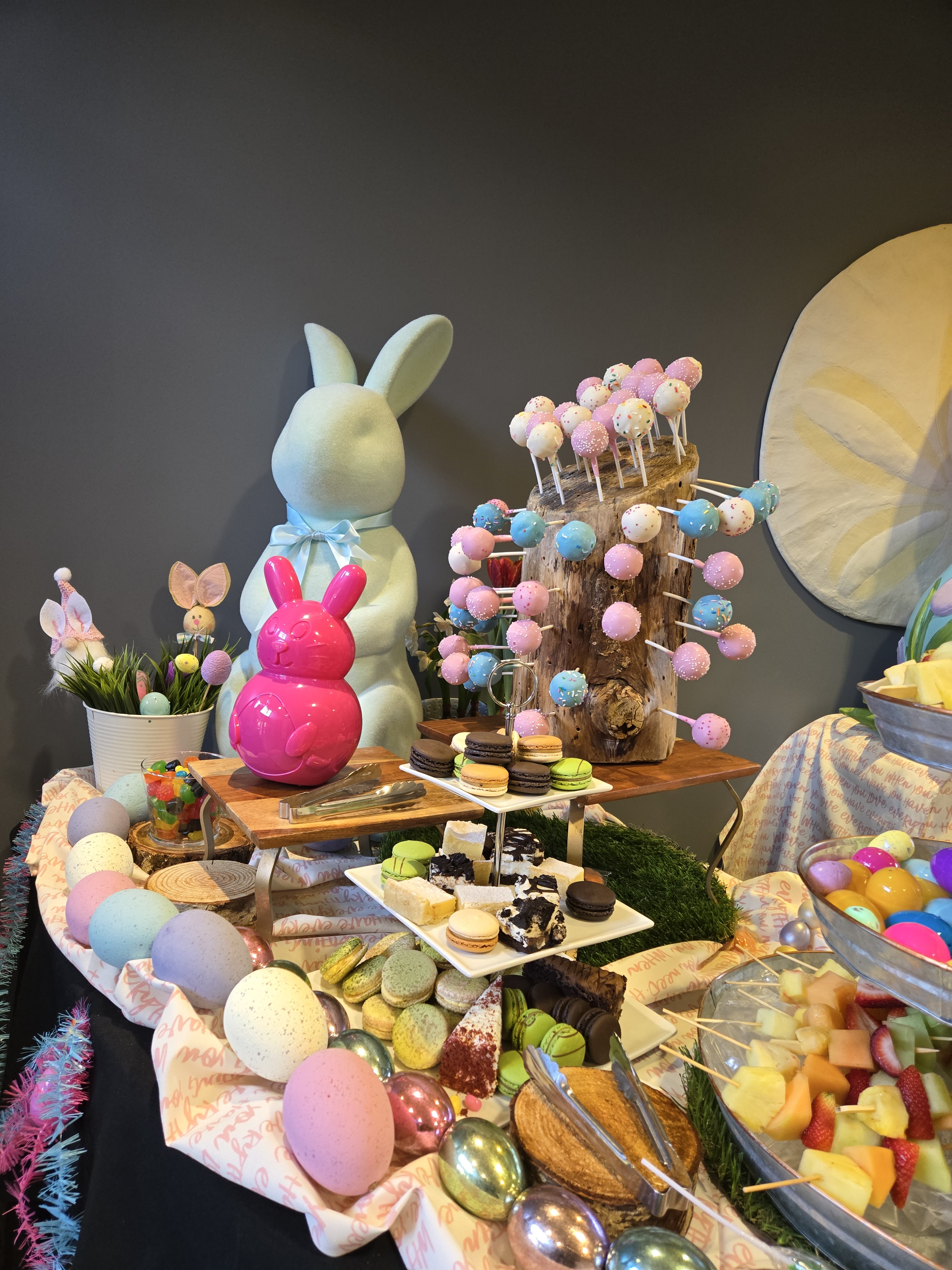 a table with food and bunny statues